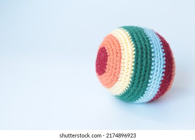 Amigurumi Knit Colorful Ball. Toy Color Ball Idea Concept. Montessori Activities For Babies. Soft Harmless Toy. No People, Nobody. Copy Space, Space For Text. Crochet. İsolated On White Background.