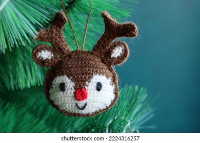 Amigurumi Reindeer close up photo. Handcrafted Christmas toy. Crochet pattern. 