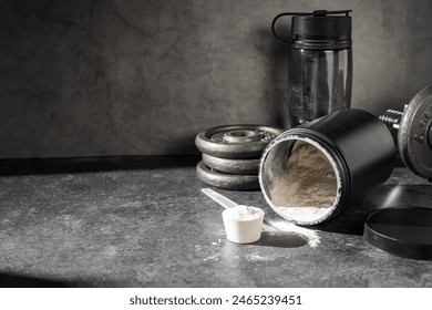 Amino acid food supplement, creatine powder in a measuring scoop and plastic jar, copy space - Powered by Shutterstock