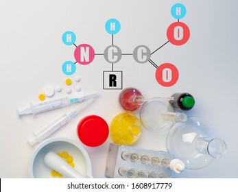 Amino Acid Formula. A Chemist Is Developing Drugs. Research On Amino Acids. Medicines On The Table. Medical Research.