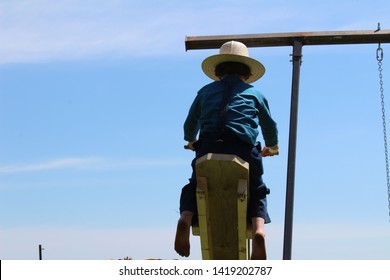 Amish Boy On A Tetter Totter