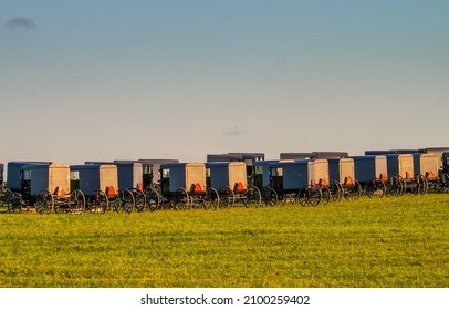 Amish Buggy's Lined Up In A Row For Funeral In The Countryside