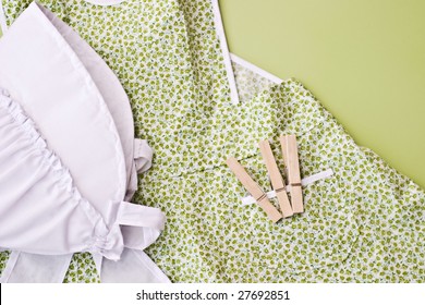 Amish Child's Bonnet And Apron With Wooden Clothes Pins