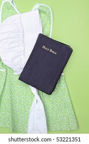 Amish Child's Clothes With Bonnet And Holy Bible.