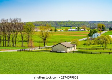 Amish country, farm, home and barn on field agriculture in Lancaster, Pennsylvania, PA US North America.