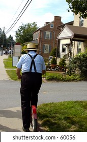 AMish Man on a Scooter