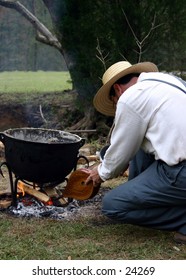 Amish Man Tending Fire