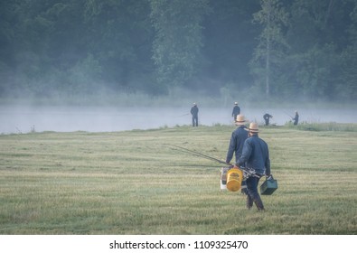 Amish Men going fishing in early Morning at Lake Flavia, South Dayton, New York, USA, June 9th 2018