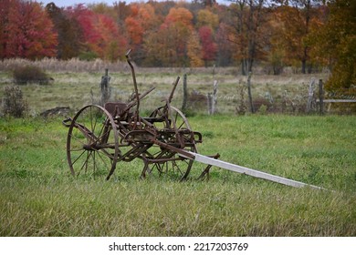 Amish Plow Sits In Field