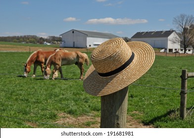 Amish Straw Hat Laying On A Fence Post In A Lancaster Pennsylvania Horse Farm