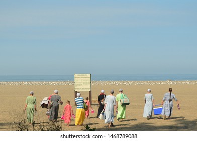 Amish Women And Children Picnic At The Beach