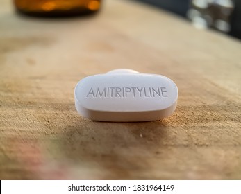 Amitriptyline White Tablet Pill Medication Used For Treatment Mental Illnesses Like Depressive Disorder And Anxiety, ADHD And Bipolar Disorder