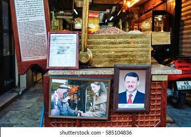 AMMAN, JORDAN - May 13, 2010 : Portrait Of HRH King Abdullah II And Queen Rania In A Peanut Stall.