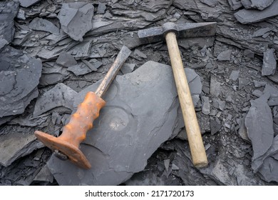 ammonia found in slate with hammer and chisel - Shutterstock ID 2171720173