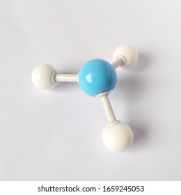 Ammonia Molecule Structure On White Background. One Blue Nitrogen, Three White Hydrogens.