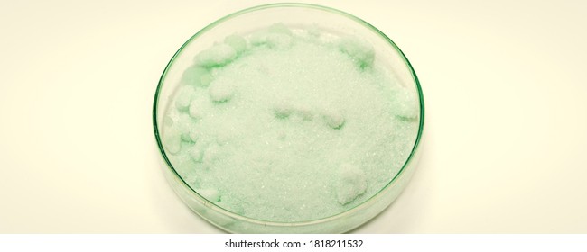 Ammonium Iron(II) Sulfate, Or Mohr's Salt In Petri Dish On White Background