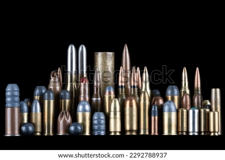Ammuninition on black background. Different cartridges for rifle, pistols and revolvers on a black background.