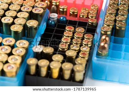 Ammunition of different sizes in the box for the background