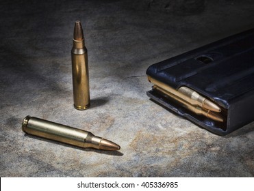 Ammunition For A Semi Automatic Rifle On A Rock With A Magazine