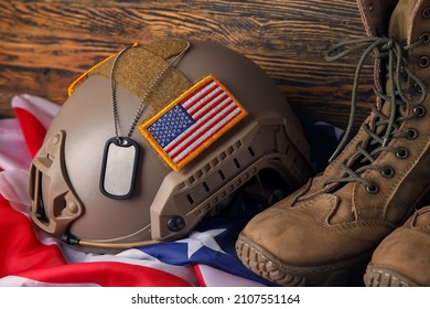 Ammunition of USA soldier on wooden background