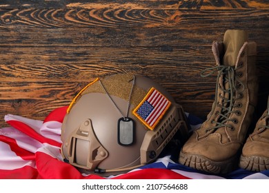 Ammunition of USA soldier on wooden background