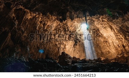Among the shadows, a ray of light opens a path of light on the staircase that unfolds and illuminates the cavern like a whisper The light give hope guide our steps towards the unexplored and adventure