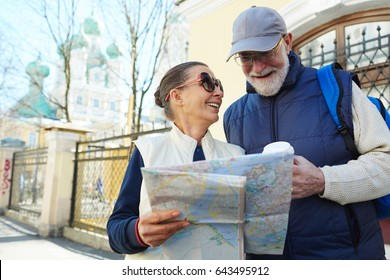 Amorous Seniors With Map Traveling In The City