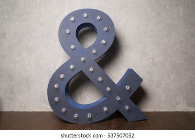 The ampersand is the logo gram "&" representing the conjunction word "and".