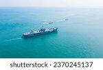 Amphibious Assault Ship. Navy aircraft carrier Aerial top view of battleship, Military sea transport, Military Navy Rescue Helicopter on board the battleship deck