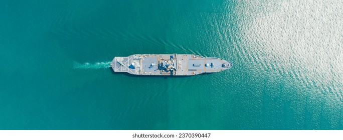 Amphibious Assault Ship. Navy aircraft carrier Aerial top view of battleship, Military sea transport, Military Navy Rescue Helicopter on board the battleship deck