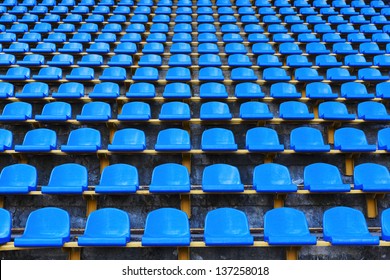 amphitheater of dark blue seats abstract background