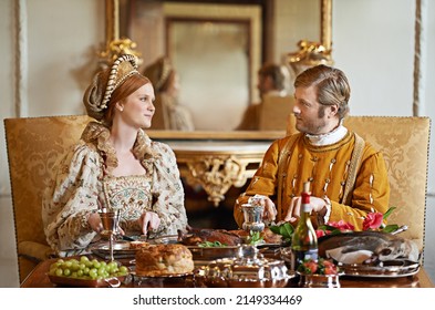 Its an ample feast. Shot of a noble couple eating together. - Shutterstock ID 2149334469