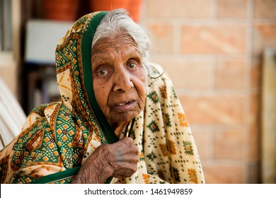 AMRAVATI, MAHARASHTRA, INDIA 19 JULY 2019 : Unidentified Old Age Traditional Indian Woman Sitting At Balcony Of Her Home In The Morning.