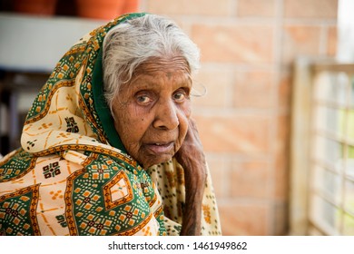 AMRAVATI, MAHARASHTRA, INDIA 19 JULY 2019 : Unidentified Old Age Traditional Indian Woman Sitting At Balcony Of Her Home In The Morning.