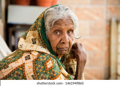 AMRAVATI, MAHARASHTRA, INDIA 19 JULY 2019 : Unidentified Old Age Traditional Indian Woman Sitting At Balcony Of Her Home In The Morning.