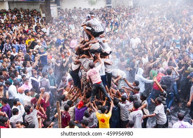 AMRAVATI, MAHARASHTRA, INDIA - 29 AUGUST 2013 : Crowd of young People "Govinda" enjoying the Dahi Handi festival to celebrate God Krishna's Birth in Amravati, Maharashtra, India.