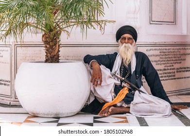 Amritsar, India - AUGUST 15, 2016:  Portrait of an Old Sikh sitting at Golden Temple (Harmandir Sahib) on August 15, 2016 in Amritsar, Panjab, India.