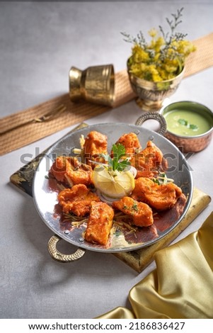 Amritsari fish tikka with raita and lime served in a dish isolated on dark background side view of fastfood