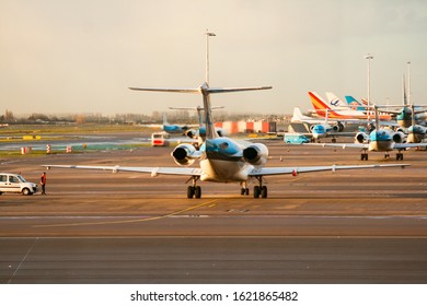 Amsterdam Airport Schiphol, Netherlands, 01/22/2008: Airplane Warming Up Engines Ready To Take Off Releasing Heat Waves Causing Light Refraction And Blurring The Background