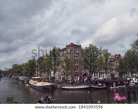 Similar – Image, Stock Photo Tranquil Amsterdam canal with iconic narrow houses