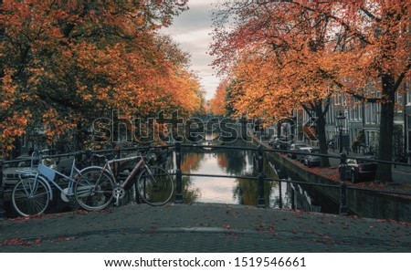 Similar – Foto Bild Architektur niederländischer Häuser Fassade und Hausboote am Amsterdamer Kanal