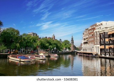 Amsterdam Cityscape And Amstel River In Netherlands.