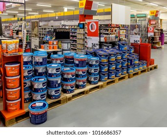 Amsterdam, February 2018. Display With A Large Number Of Big Buckets Of Wall Paint In A DIY Shop