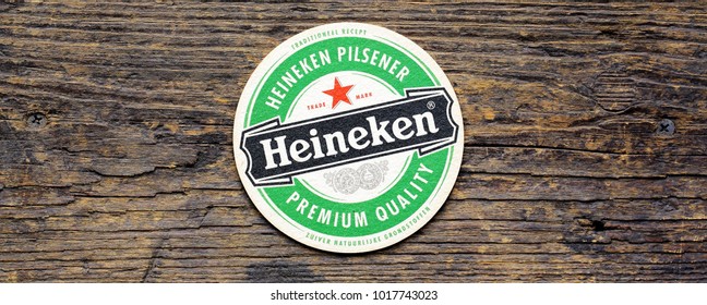 AMSTERDAM, HOLLAND - April 2, 2017.: Beer mats from Heineken Lager Beer in vintage background , it was first brewed by Gerard Adriaan Heineken in 1873