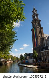 Amsterdam, Holland - August 5 2018 : View Of The Westerkerk Church Displaying A Huge Rainbow Lgbt Flag On The Tower During The Amsterdam Pride Canal Parade