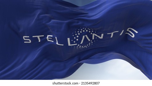 Amsterdam, Holland, March 2022: Close-up view of the blue flag with the Stellantis logo waving in the wind. Stellantis is a Dutch multinational motor vehicle holding company.