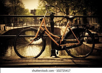 Amsterdam, Holland, Netherlands. Romantic canal bridge, retro bike. Old town
