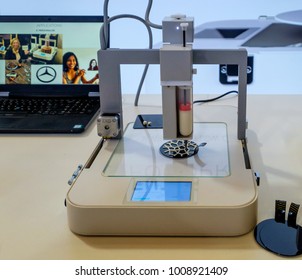 Amsterdam, January 2018. Close Up Of A 3d Food Printer At Work, With A Laptop In The Background