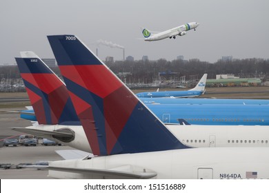 AMSTERDAM, MARCH 3 : KLM and Delta airlines planes at Schiphol Airport march 3, 2013 in Amsterdam,The Netherlands.