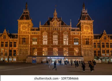 Amsterdam May 18 2018 - Travelors Leaving And Entering The Central Train Station Of Amsterdam At Night